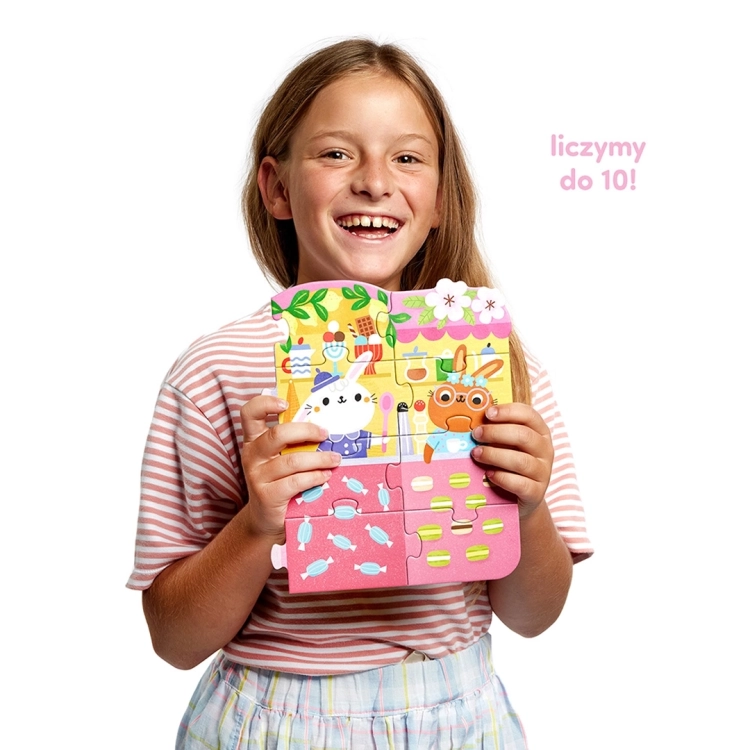 Dziecko z puzzlami cyfry króliczki czuczu