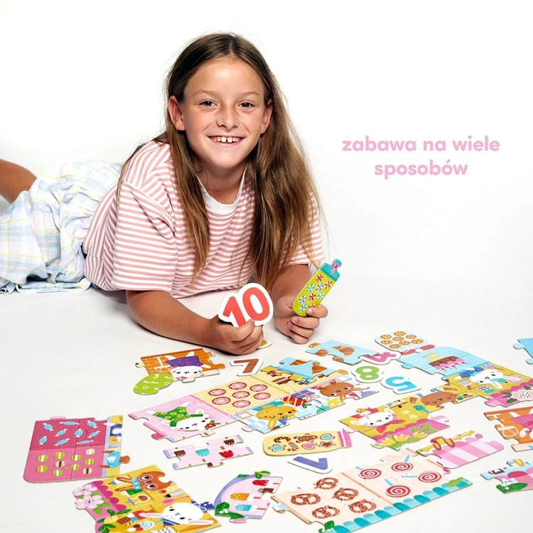 Dziecko układające puzzle cyfry króliczki