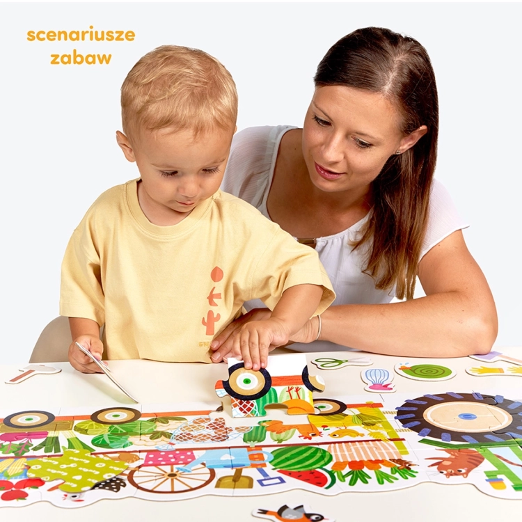 Dziecko układające moto puzzle traktor z rodzicem