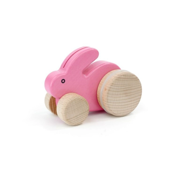 Drewniany mały królik skaczący na kółkach różowy