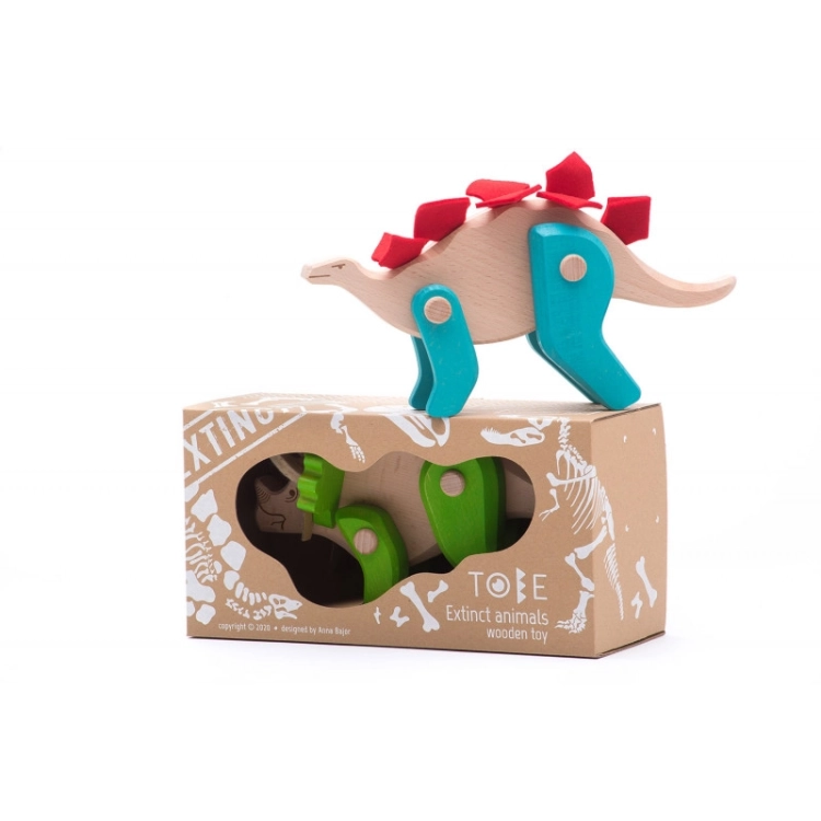Zabawka drewniana Stegozaur Bajo z czerwonymi kolcami na opakowaniu