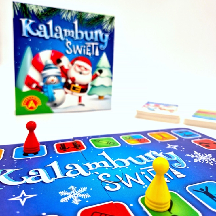 Kalambury Święta - plansza i pionki: Plansza do gry "Kalambury Święta" w niebieskiej kolorystyce z ilustracjami symboli i pionkami w różnych kolorach.