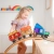 Dziewczynka bawiąca się pojazem z klocków magnetycznych CONNETIX Rainbow Transport Pack