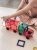 Dziecko bawiące się samochodem z klocków magnetycznych CONNETIX Rainbow Motion Pack
