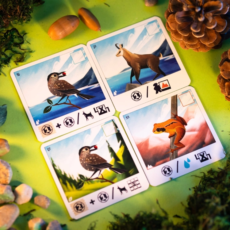 karta gry Alpina z ptakiem w alpejskim krajobrazie