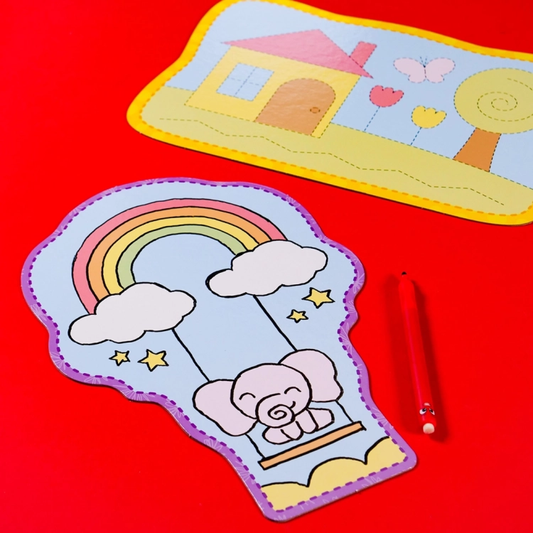 Rysunkowa tabliczka z balonem, chmurkami i słoniem – wzór do kolorowania lub ćwiczeń.