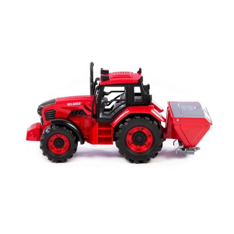 Widok z boku na traktor Belarus z siewką – zabawka rolnicza Polesie