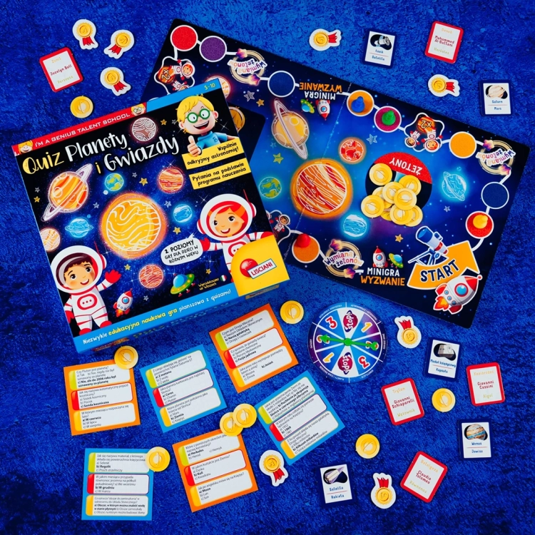 Pełna zawartość gry Quiz Planety i Gwiazdy rozłożona na podłodze