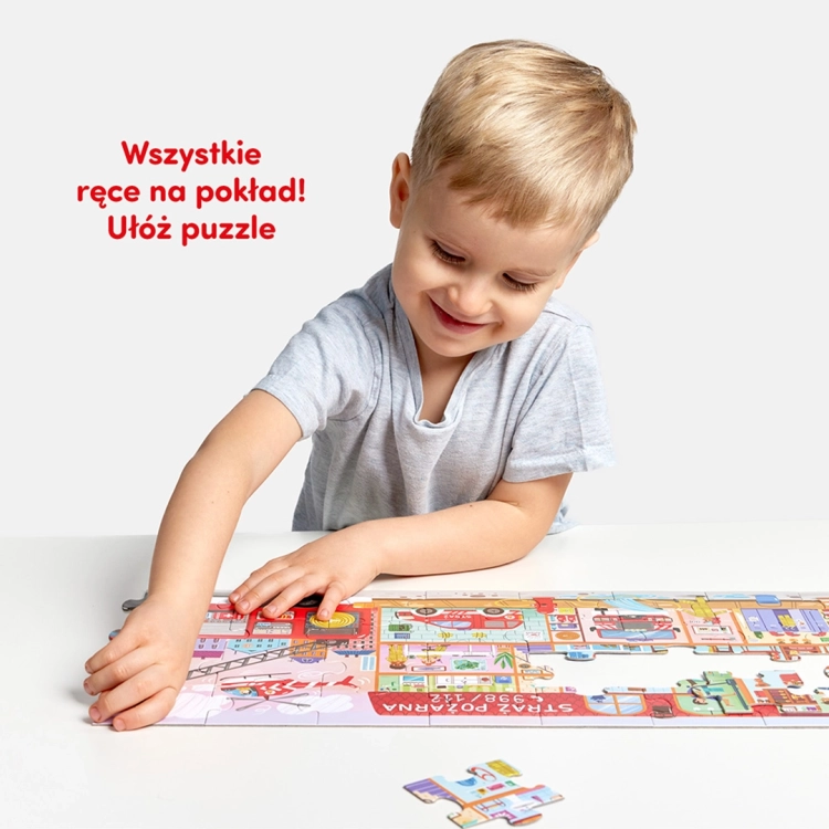 Dziecko układa puzzle strażackie na stole, edukacyjna zabawa z serii Tak działa