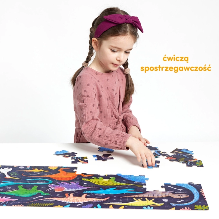 Dziewczynka układa puzzle Grr Dinozaury 60 elementów od CzuCzu