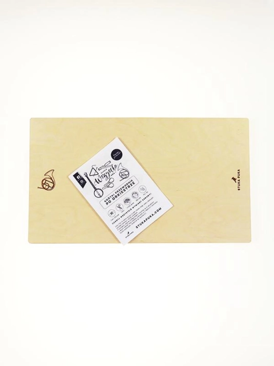 Pusta drewniana rama puzzli "Wszystko gra" z ulotką informacyjną i logo producenta.