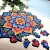 puzzle drewniane mandala na tle jasnej powierzchni i roślin doniczkowych