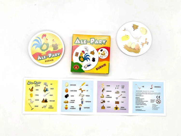Pudełko, okrągłe karty i złożona instrukcja gry Ale Pary Kurnik, prezentujące elementy zestawu.