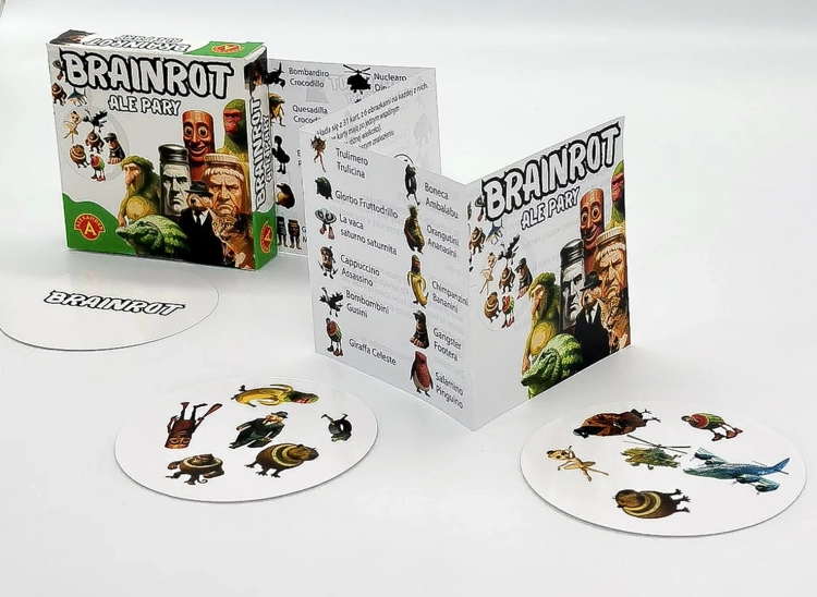 Pudełko gry "Brainrot Ale Pary" z rozłożoną instrukcją i dwoma okrągłymi kartami z surrealistycznymi ilustracjami.