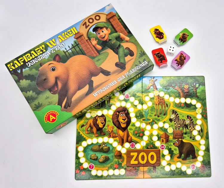 Pudełko gry "Kapibary w akcji – Ucieczka z zoo" i plansza z pionkami i kostkami.
