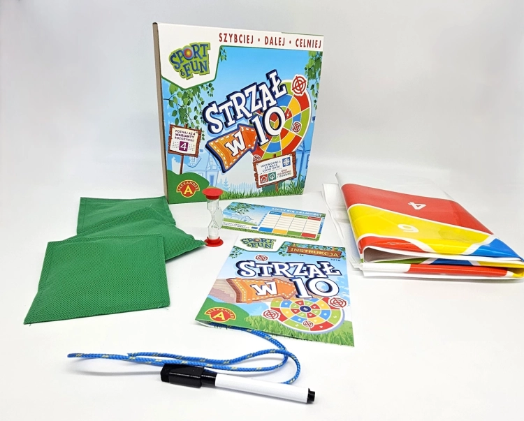 Wszystkie elementy gry zręcznościowej "Strzał w 10" ułożone na białym tle.
