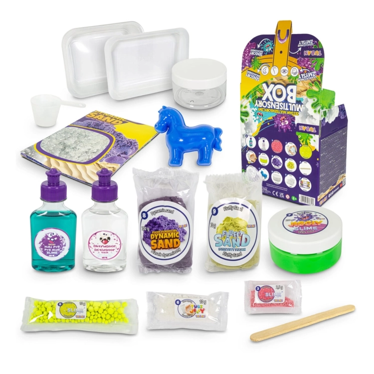 Wszystkie elementy zestawu Multisensory Box Tuban rozłożone na białym tle, widoczne pojemniki, proszki, butelki i akcesoria.