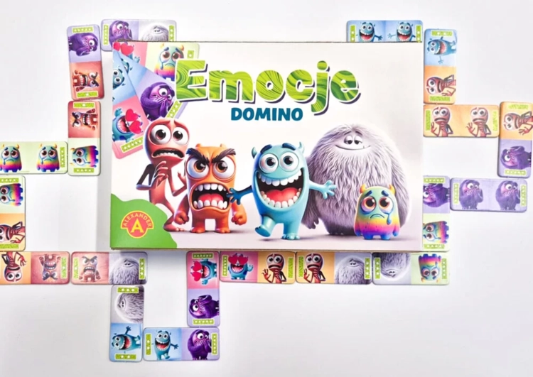 Gra edukacyjna Domino Emocje Alexander, ułożone klocki wokół opakowania na białym tle.