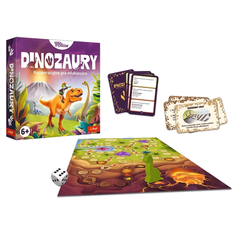 Kompletny zestaw gry planszowej DINOZAURY Rodzina Treflików: pudełko, plansza z wulkanem, pionek dinozaur, kostka, karty quizowe/specjalne na białym tle.