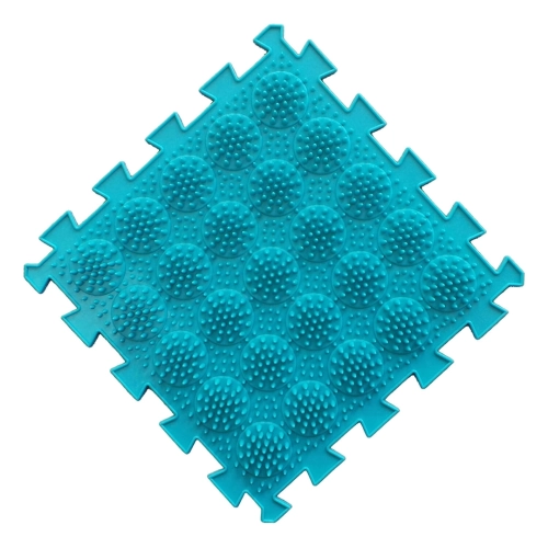 Pojedynczy turkusowy moduł maty sensorycznej o fakturze wypukłych okręgów z drobnymi wypustkami i brzegami typu puzzle.