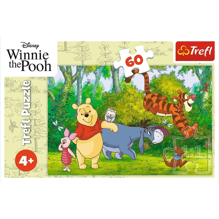 Front opakowania puzzli Disney "Winnie the Pooh" marki Trefl na białym tle z widocznym wzorem graficznym.