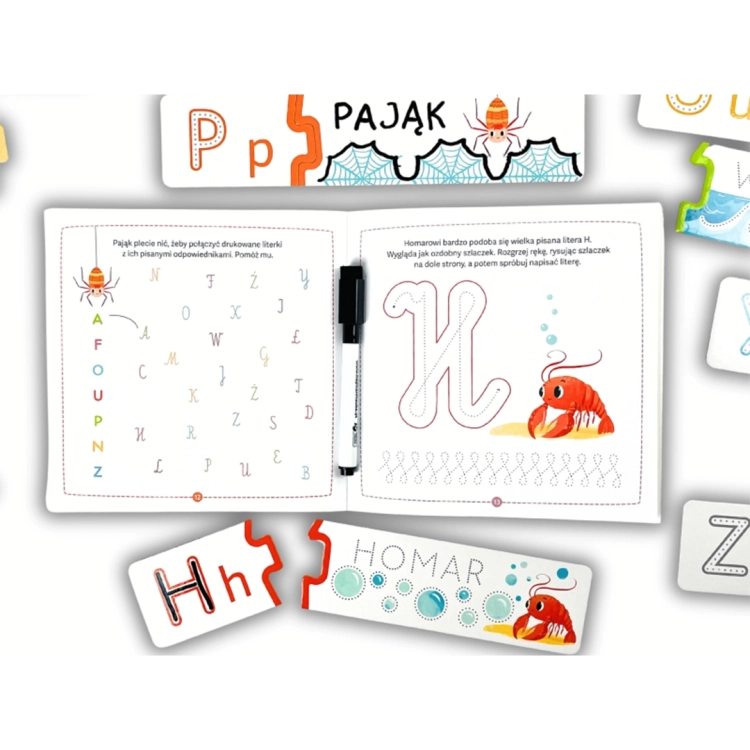 Otwarta książeczka do nauki pisania z ćwiczeniami grafomotorycznymi oraz pasujące do niej puzzle z pająkiem i homarem.