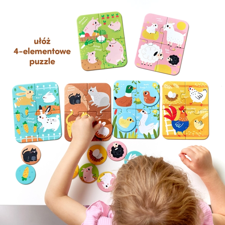 Dziecko trzyma przed oczami dwa okrągłe żetony z ilustracjami myszki i kotka, udając okulary.