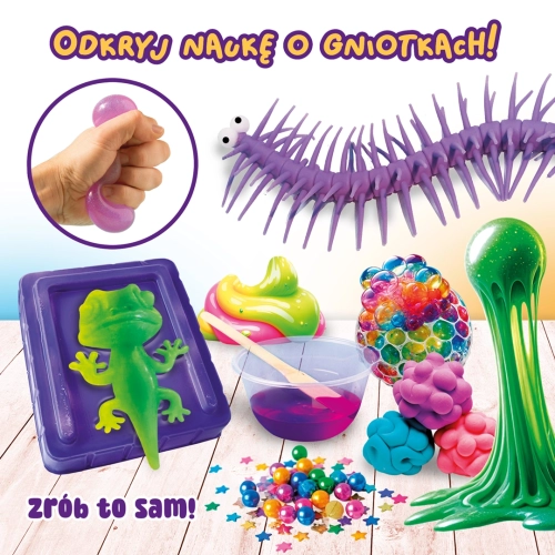 Prezentacja gniotków o różnych fakturach: żelowa jaszczurka, siatkowy gniotek, kolorowe masy, brokatowe gwiazdki i fioletowa stonoga.
