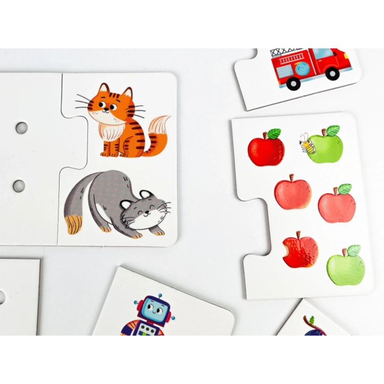 Detale puzzli: ilustracja dwóch kotków obok elementu z dziurkami oraz zestaw sześciu jabłek z gąsienicą.