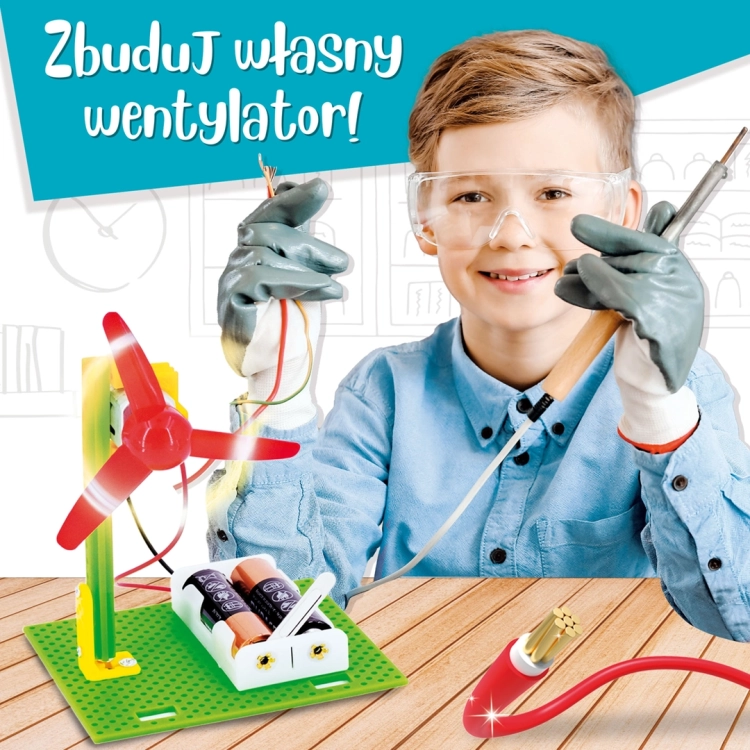 Chłopiec w okularach ochronnych prezentuje samodzielnie zbudowany wentylator z zestawu naukowego Lisciani do nauki fizyki.