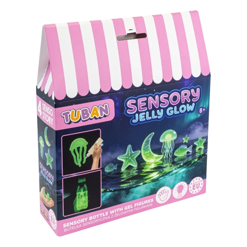 Kolorowe, kartonowe opakowanie zabawki Sensory Jelly Glow marki Tuban, przypominające domek w różowo-białe pasy. Przedstawia świecące w ciemności żelowe figurki morskich stworzeń, księżyca i gwiazd pływające w wodzie.