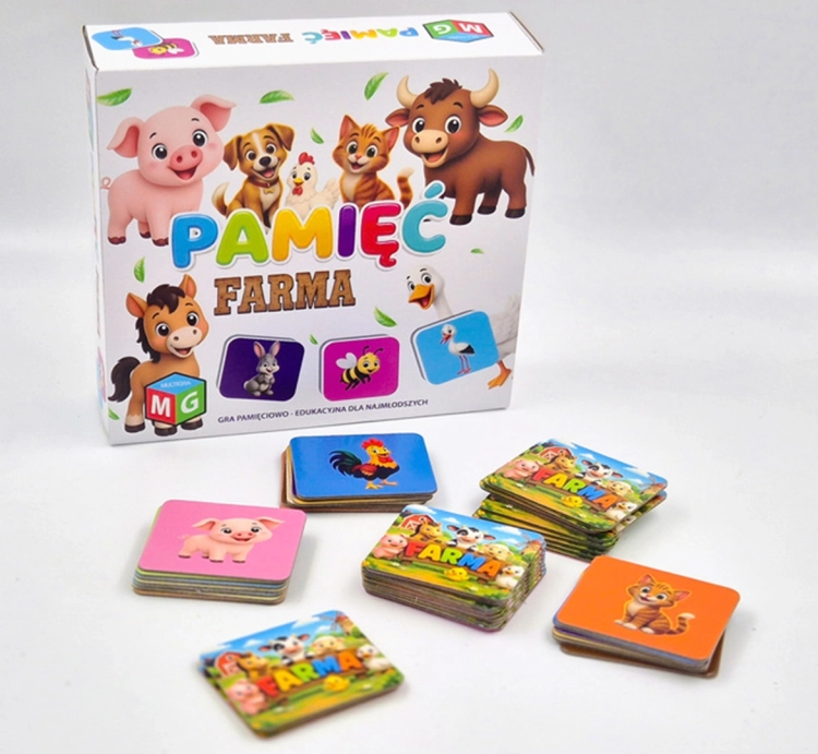 Pudełko gry Pamięć Farma i ułożone obok stosiki kart z ilustracjami zwierząt.
