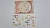 Udekorowany naklejkami pierożków i dodatków talerz na planszy oraz arkusze z naklejkami wielorazowego użytku.